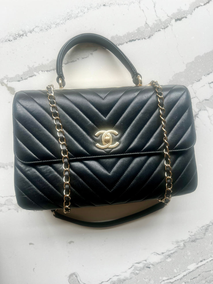 Chanel trendy black chevron bag with gold hardware